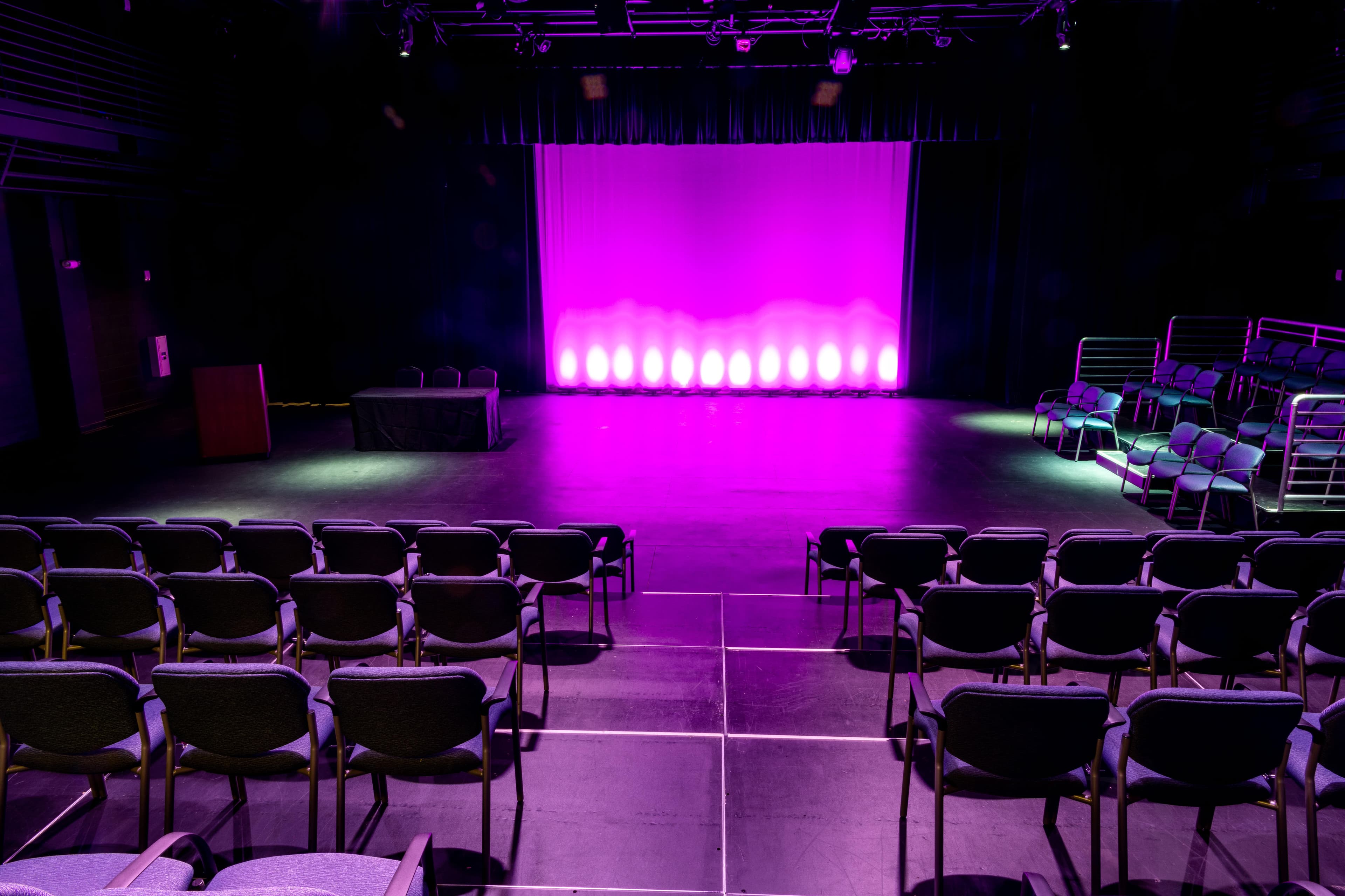 Families cheering during a folklórico performance inside the competition arena